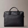Bolso de viaje con monograma en relieve Bolso de viaje con monograma en relieve