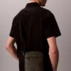 Bolso tipo reporter con logotipo en relieve por toda la superficie Bolso tipo reporter con logotipo en relieve por toda la superficie