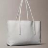 Bolso tote con el logotipo del emblema en toda la superficie y bolsillo Bolso tote con el logotipo del emblema en toda la superficie y bolsillo