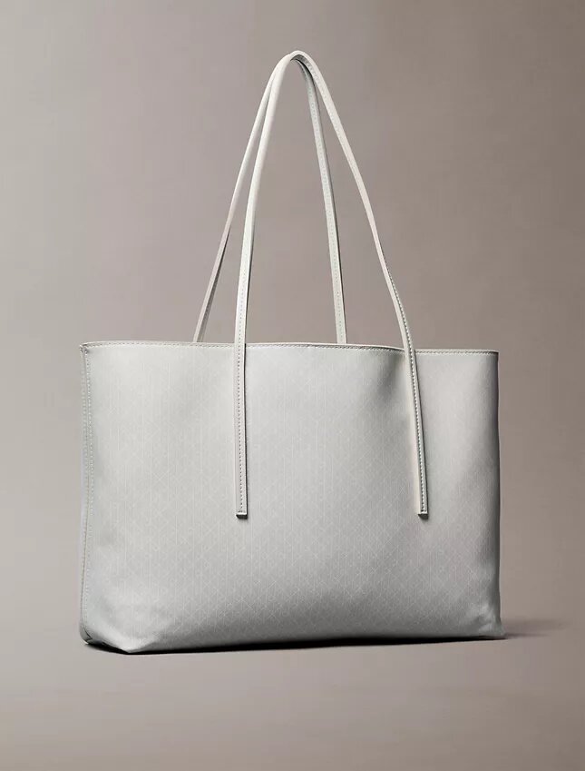 Bolso tote con el logotipo del emblema en toda la superficie y bolsillo Bolso tote con el logotipo del emblema en toda la superficie y bolsillo