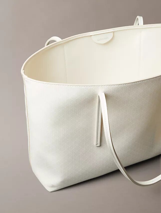 Bolso tote con el logotipo del emblema en toda la superficie y bolsillo Bolso tote con el logotipo del emblema en toda la superficie y bolsillo