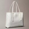 Bolso tote pequeño con estampado del logotipo en todo el diseño y bolsillo Bolso tote pequeño con estampado del logotipo en todo el diseño y bolsillo