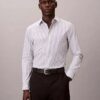 Camisa ajustada con botones y rayas de tejido técnico elástico Camisa ajustada con botones y rayas de tejido técnico elástico