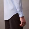 Camisa ajustada con botones y tejido elástico Camisa ajustada con botones y tejido elástico