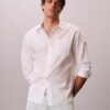 Camisa de popelín lavado con botones y corte holgado Camisa de popelín lavado con botones y corte holgado