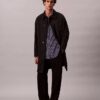 Camisa de rayas con botones, confeccionada en mezcla de viscosa y corte relajado Camisa de rayas con botones, confeccionada en mezcla de viscosa y corte relajado