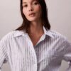 Camisa holgada de popelín a rayas con botones Camisa holgada de popelín a rayas con botones