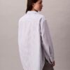Camisa holgada de popelín a rayas con botones Camisa holgada de popelín a rayas con botones