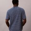 Camiseta holgada con gráfico de logotipo a rayas Camiseta holgada con gráfico de logotipo a rayas