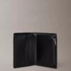Cartera doble con monogram en relieve y compartimento para monedas Cartera doble con monogram en relieve y compartimento para monedas