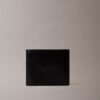 Cartera doble con relieve Monólogo