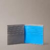 Cartera doble con relieve Monólogo