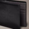 Cartera doble con relieve Monólogo