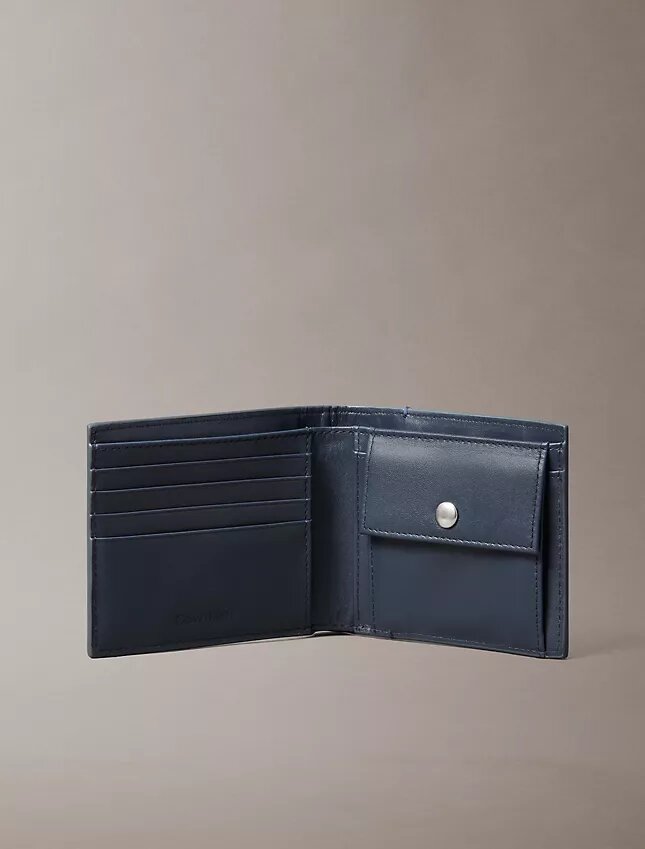 Cartera plegable con el logotipo del emblema en toda la superficie y bolsillo para monedas Cartera plegable con el logotipo del emblema en toda la superficie y bolsillo para monedas