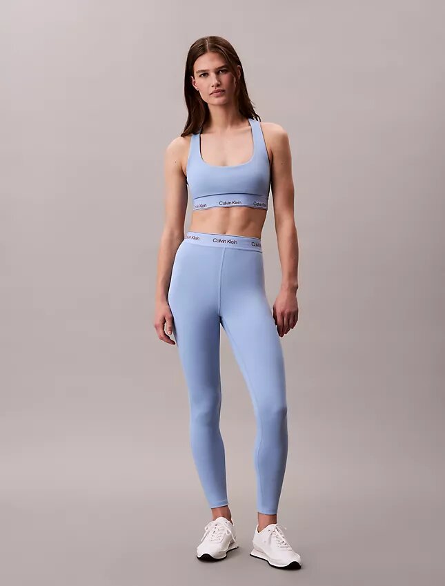 Leggings deportivos modernos de talle alto con logo en la cintura y corte 7/8 Leggings deportivos modernos de talle alto con logo en la cintura y corte 7/8