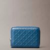Monogram con cremallera y monograma en relieve por toda la superficie Monogram con cremallera y monograma en relieve por toda la superficie