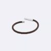Pulsera de cuero con placa de identificación biselada