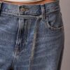 Vaqueros holgados de talle bajo con cinturón Vaqueros holgados de talle bajo con cinturón